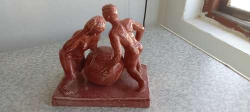 Stunning Solid Sculpture of Woman and Guy with Ball