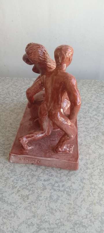 Stunning Solid Sculpture of Woman and Guy with Ball