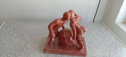 Stunning Solid Sculpture of Woman and Guy with Ball