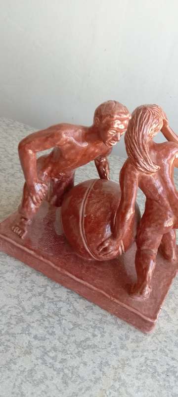 Stunning Solid Sculpture of Woman and Guy with Ball