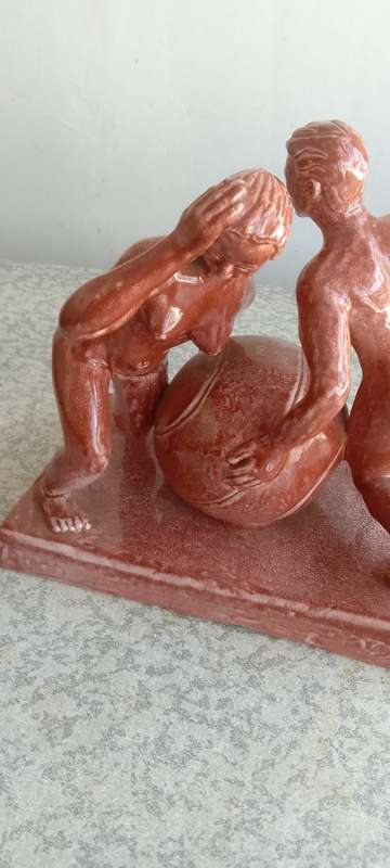 Stunning Solid Sculpture of Woman and Guy with Ball