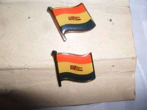 A SET OF  OLD SOUTH AFRICAN LAPEL PINS PLUS HAND HELD FLAG -SMALL