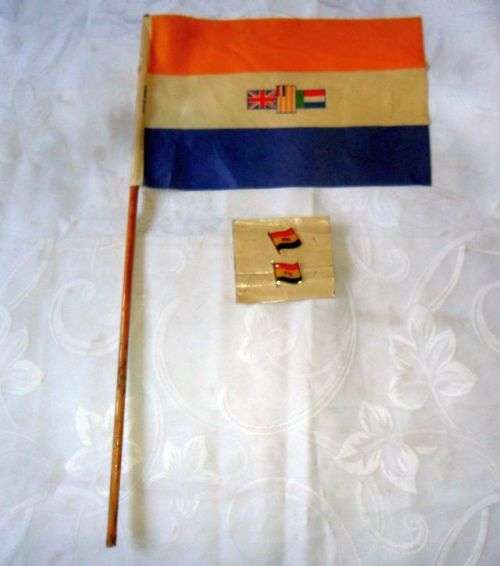 A SET OF  OLD SOUTH AFRICAN LAPEL PINS PLUS HAND HELD FLAG -SMALL