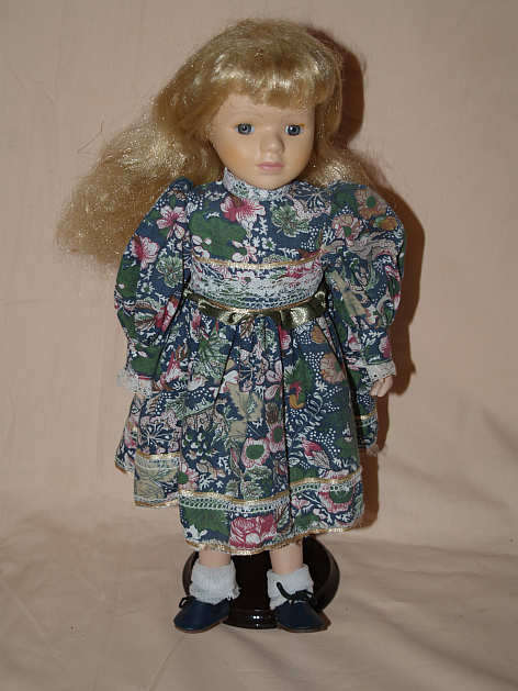 PORCELAIN DOLL ON STAND