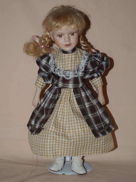 PORCELAIN DOLL ON STAND