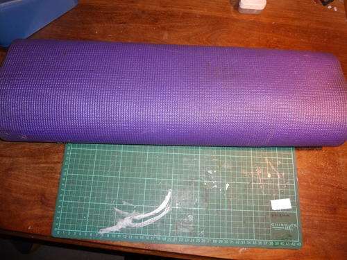 yoga matt - never used - purple in colour