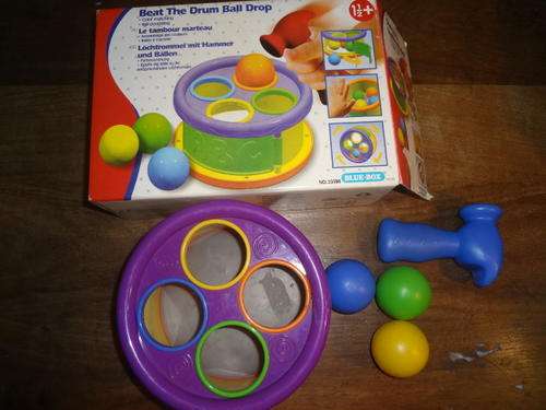 baby toy - drum ball drop - 1 ball replaced with green stress ball