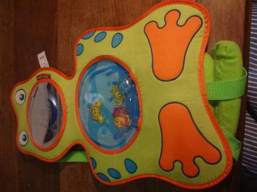Tiny Love interactive toy - press the side to create a jet stream that moves the fish