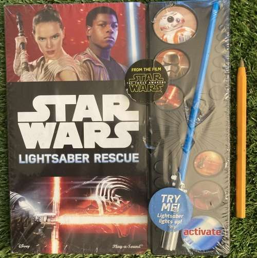 Hard Pages Book with Electronic sounds and non removable mini Lightsaber