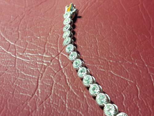 LOVELY SOLID GENUINE STERLING SILVER TENNIS BRACELET IN PRISTINE CONDITION