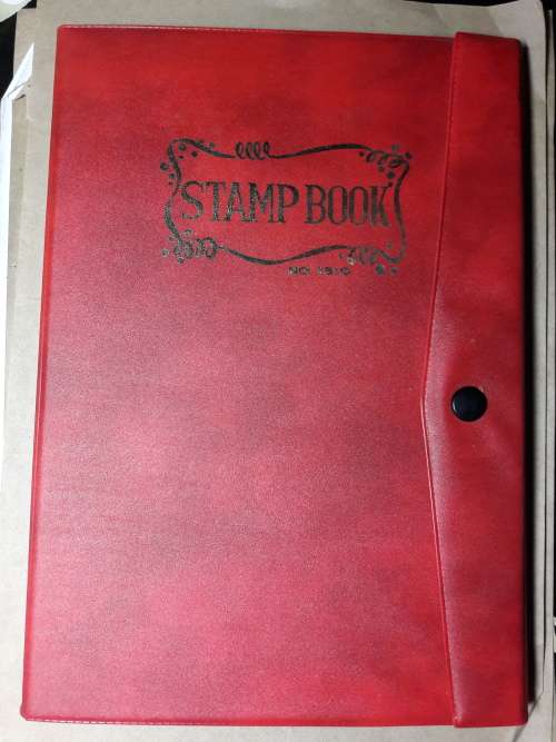 STAMP ALBUM WITH 230 STAMPS