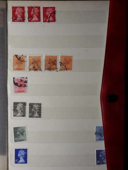 STAMP ALBUM WITH 230 STAMPS