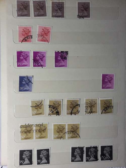 STAMP ALBUM WITH 230 STAMPS