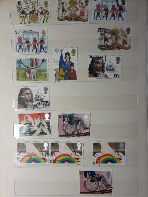STAMP ALBUM WITH 230 STAMPS