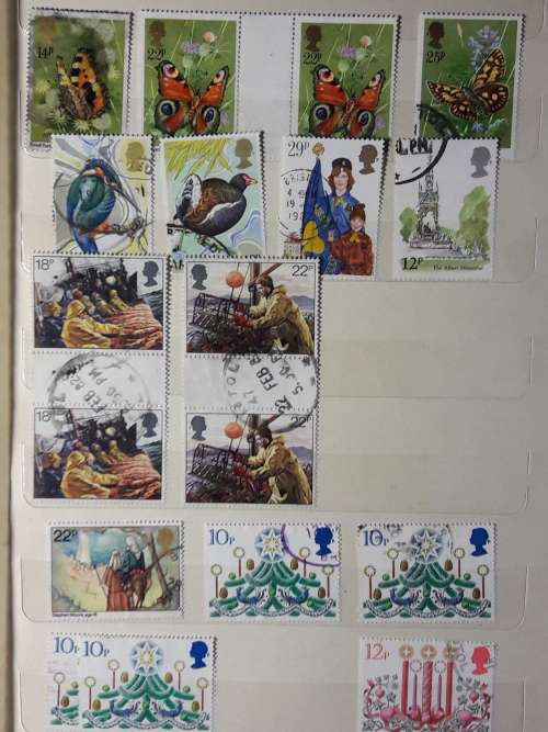 STAMP ALBUM WITH 230 STAMPS