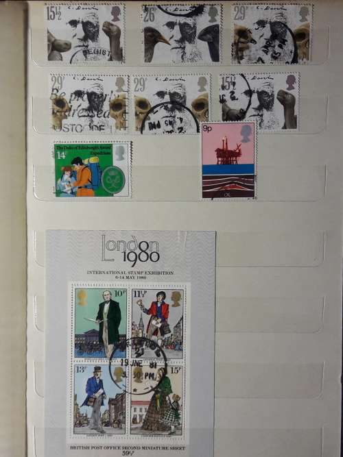 STAMP ALBUM WITH 230 STAMPS