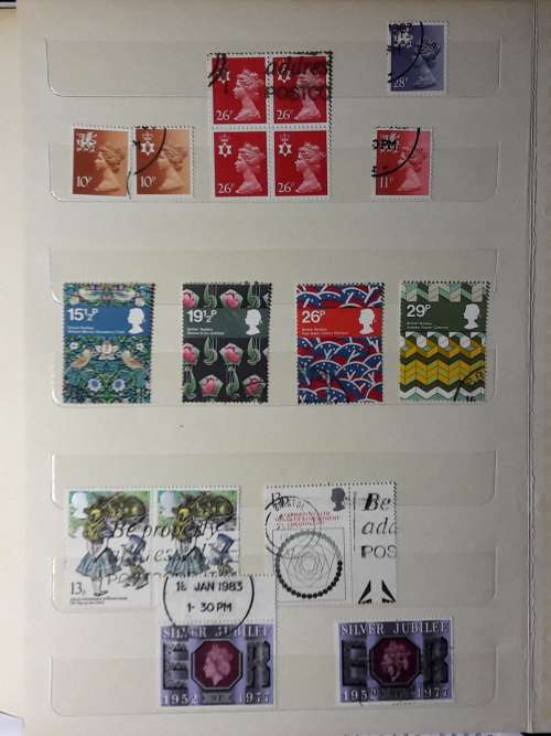 STAMP ALBUM WITH 230 STAMPS