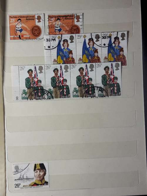 STAMP ALBUM WITH 230 STAMPS