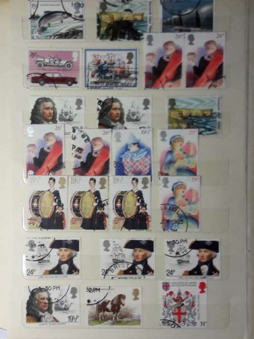 STAMP ALBUM WITH 230 STAMPS