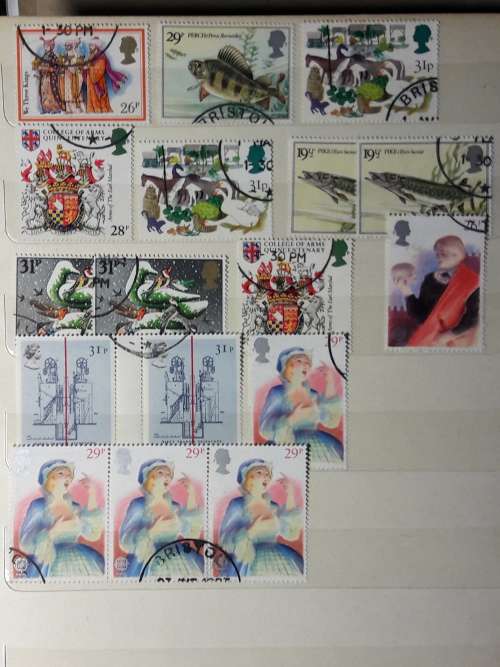 STAMP ALBUM WITH 230 STAMPS