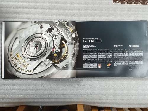 TAG HEUER BOOK 127 PAGES HARD COVER WITH COLOUR FOTO`S ON EACH PAGE IN EXCELLENT CONDITION - RARE