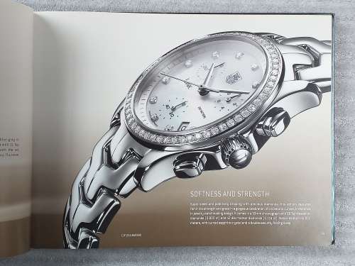 TAG HEUER BOOK 127 PAGES HARD COVER WITH COLOUR FOTO`S ON EACH PAGE IN EXCELLENT CONDITION - RARE