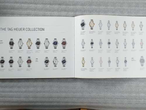 TAG HEUER BOOK 127 PAGES HARD COVER WITH COLOUR FOTO`S ON EACH PAGE IN EXCELLENT CONDITION - RARE