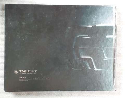 TAG HEUER BOOK 127 PAGES HARD COVER WITH COLOUR FOTO`S ON EACH PAGE IN EXCELLENT CONDITION - RARE