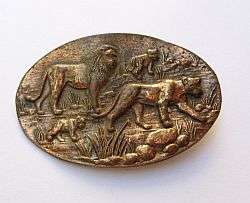 AN INTRICATELY DESIGNED VINTAGE OLD SOUTH AFRICA COPPER BROOCH