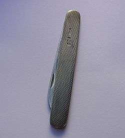 A HALLMARKED SILVER KNIFE - BLADE AND HANDLE ARE STERLING SILVER