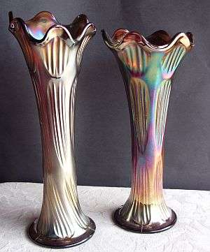 A spectacular pair of Carnival glass vases