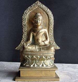 A solid brass figure - Tibetan Buddha