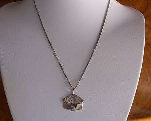 HOW DIFFERENT IS THIS ... A STERLING SILVER LESOTHO HUT PENDANT ON A STERLING SILVER NECKLACE