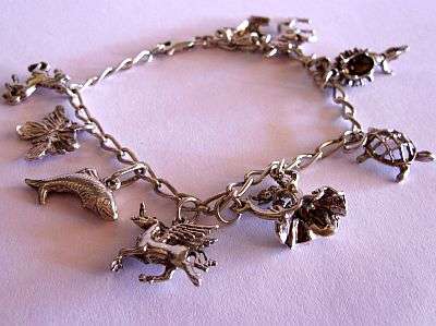24 HR AUCTION !!!! STERLING SILVER CHARM BRACELET WITH AMAZING CHARMS
