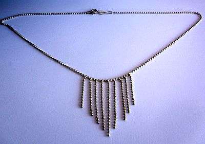 A DINGLY DANGLY KNOBBLY STERLING SILVER NECKLACE