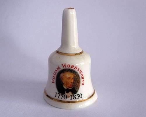 A VERY CUTE MINIATURE PORCELAIN BELL MADE IN ENGLAND DEPICTING WILLIAM WORDSWORTH