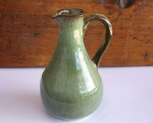 A VINTAGE POTTERY EWER - NUMBERED - PROBABLY BY GLOBE