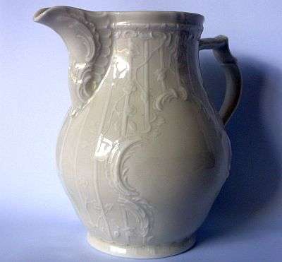 A CLASSY PORCELAIN CREAMER IN THE SANSSOUCI PATTERN BY ROSENTHAL OF GERMANY