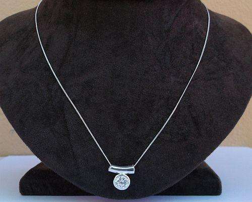 AN ELEGANT STERLING SILVER NECKLACE AND PENDANT SET WITH A FACETED CLEAR STONE ...PRAGTIG !!!