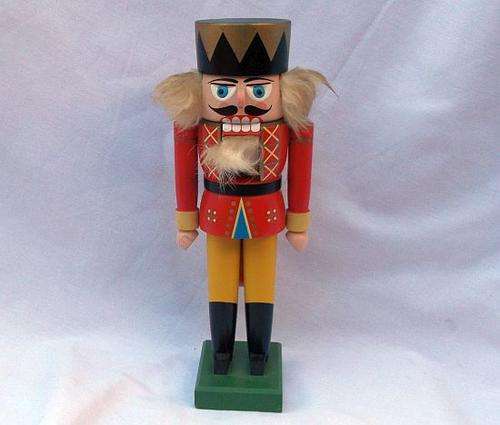 AN ADORABLE VINTAGE HAND CRAFTED WOODEN NUTCRACKER MADE IN GERMANY .....CRUNCH TIME ....