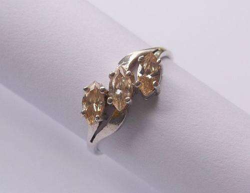 A CLASSY STERLING SILVER RING SET WITH MARQUISE CUT STONES WITH A YELLOWISH ORANGE TINGE !!! SWEET !