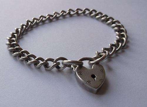 LATE ENTRY !! A GREAT QUALITY VINTAGE STERLING SILVER CHARM BRACELET WITH HEART SHAPED CLASP ...WOW