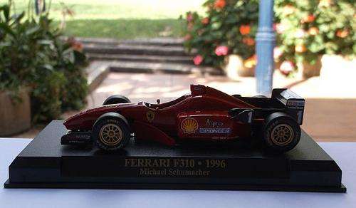 1:43 FERRARI F310 1996 MICHAEL SCHUMACHER DIE CAST METAL MODEL ON STAND ...AWESOME DETAILS