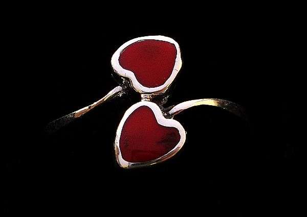 TRULY LOVELY !! A SOLID STERLING SILVER RING IN THE FORM OF TWO HEARTS WITH RED INSETS ....SWEET !!