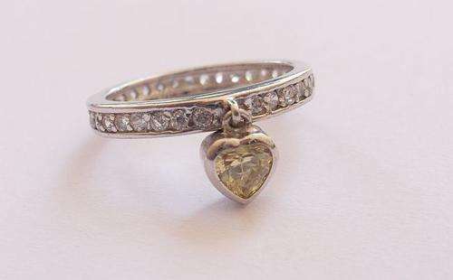 AN EXTRA EXTRAORDINARY SOLID STERLING SILVER ETERNITY RING WITH A DANGLING HEART !! DESIGNER MADE !!