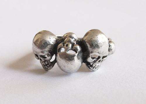 TOTALLY WICKED !!! A SOLID STERLING SILVER RING WITH SKULLS DECORATION ....AWESOME !!