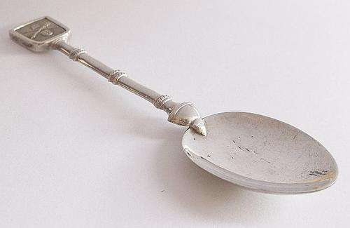 AN AWESOME STERLING SILVER DESIGNER TEASPOON DEPICTING THE OLD SA PARLIAMENTARY C.O.A BY PAGLIARI