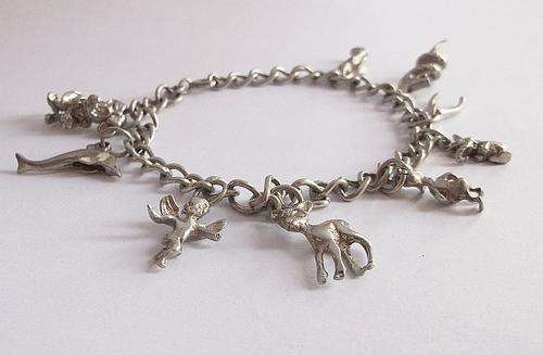 AN AMAZING VINTAGE STERLING SILVER CHARM BRACELET FEATURING DONALD DUCK & MINNIE MOUSE !!!!