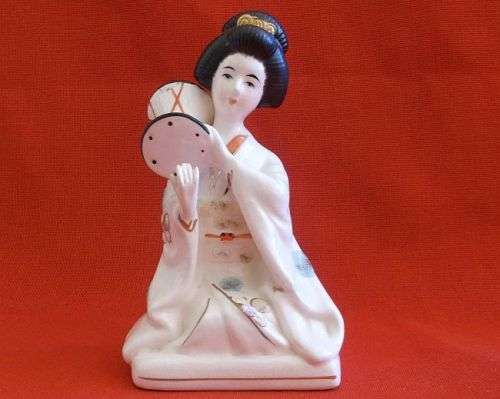 A VINTAGE DETAILED PORCELAIN JAPANESE ""GIRL IN A BAND"" FIGURE ....FRAGILE AND RARE ....MUST SEE !!