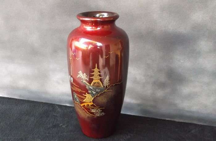A VINTAGE JAPANESE VASE WITH ABALONE INLAY AND HAND PAINTED DETAIL OVER LACQUER / ENAMEL ?